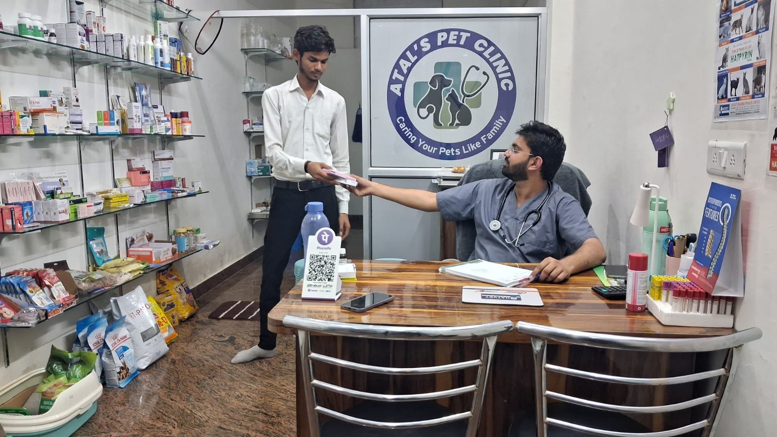 Dr. Avinash Atal attending to a patient consultation at Atal's Pet Clinic Jagatpura